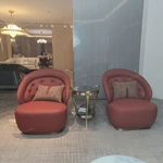 Cream Diamond-Tufted Leather Sofa with Scroll Armrests and Dark High-Gloss Wood Sides